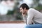 Pensive worried man sitting on a bench