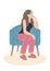Pensive Young Woman Sitting in Armchair