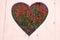 Penstemon barbatus Elfin red flower Heart Shape White Wood Background