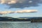 PENTICTON, CANADA - JULY 04, 2020: lake landscape with sailboats calm morning with cloudy sky