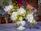 Peony flowers arranged in baroque style in a white porcelain vase.