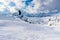 Peope snowkiting in a breathtaking witer mountain scenery