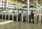 People in the access control lathes at the modern train station of Cadiz, Spain