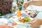 People adding topping for smoked salmon salad at food line in ho