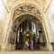 People admiring the magnificently decorated triumphal arch of Th