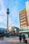 People on Alexanderplatz with view on Television tower in Berlin