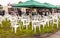 People of all ages eating and drinking in a muddy field