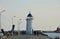 People approaching the old lighthouse on the seafront of the Mangalia city in Romania