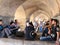 People in the arches under the Khaju Bridge in Isfahan, Iran