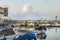 People and army on the wall of the fishing harbour of Tyre, Lebanon