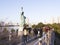 People around the Statue of Liberty on the waterfront