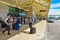 People arriving at an airport and checking luggage at Orlando International Airport.