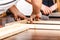 People assembling wood furniture. DIY.