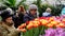 People attend spring flowers market at day time