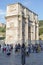 People on the background of the Arc de Triomphe of Emperor Constantine in Rome