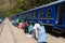 People and baggages on railway track to Machu Picchu, Peru