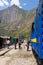 People and baggages on railway track to Machu Picchu, Peru