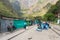 People and baggages on railway track to Machu Picchu, Peru