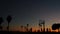 People on basketball court playing basket ball game. Sunset on beach, California