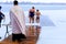 People bathe in the river during the Orthodox Epiphany, a priest in church clothes reads a prayer and sanctifies the water