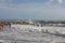 People bathing in rough seas