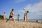 People on the beach playing volleyball