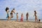 People on the beach playing volleyball