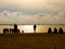 People on the beach at sunset