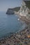 People on the beach and the white cliffs - Durdle Door, England.