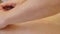People, beauty, spa, healthy lifestyle and relaxation concept - close up of beautiful woman lying and having hand