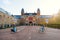 People on bicycles passing by Rijksmuseum in Amsterdam.