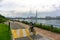 People bike and walk on the Seoul bicycle path along the Han river with Lotte world tower on the background