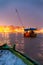 People on the boat floating on the river are going to pray at Varanasi Ganga Aarti at holy Dasaswamedh Ghat.