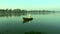 People on a boat, The young fishermen is floating on the lake.