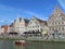 People boating and chilling out at riverside of Ghent old town, 18th May 2014, Ghent, Belgium
