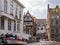 People and boats, corner Kraanrei and Groenerei canals in old town of Bruges, Belgium