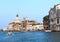 people on boats in venice. sea â€‹â€‹in italy. view of the cathedral and the house. home on stilts. bo