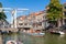 People in boats on Voordam canal in Alkmaar, Netherlands