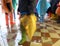 people with boots during the flood in Venice in Italy