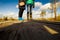 People in boots walk along a wooden path in a swamp in Yelnya, Belarus