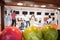 People Bowling With Balls in Foreground