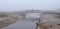 People on a bridge on a very foggy day