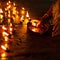 People burning oil lamps in Hindu temple. India