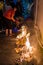 People burning paper in a religious festival ceremony