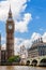 People and Buses on Westminster Bridge by Big Ben, London, England