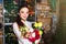 People, business, sale and floristry concept - happy smiling florist