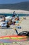 People on busy active kitesurfing beach in Spain