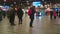 People in busy railway station. Passengers waiting for train, checking timetable