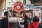 People buying mini pancakes from a Planet Pancake stand at Greenwich Market, London,UK