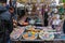 People buying oriental souvenirs at the street shop